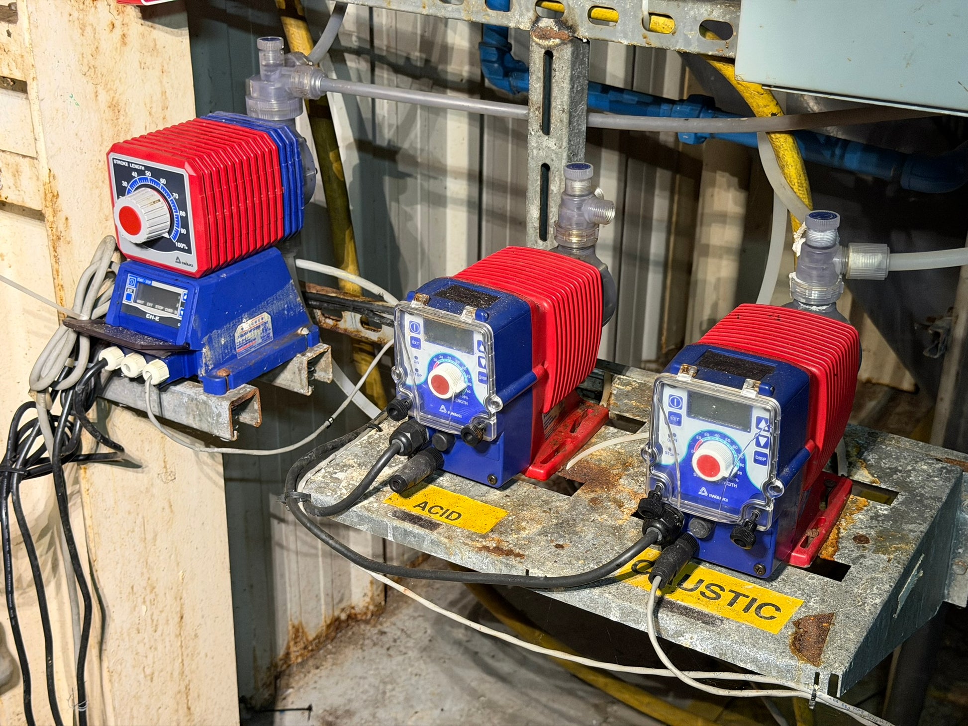 PU-01: Iwaki / Walchem chemical metering pumps — three-unit station. overview photograph 1.