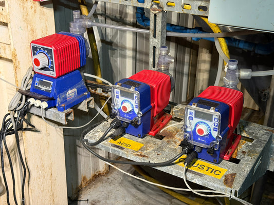 PU-01: Iwaki / Walchem chemical metering pumps — three-unit station. overview photograph 1.