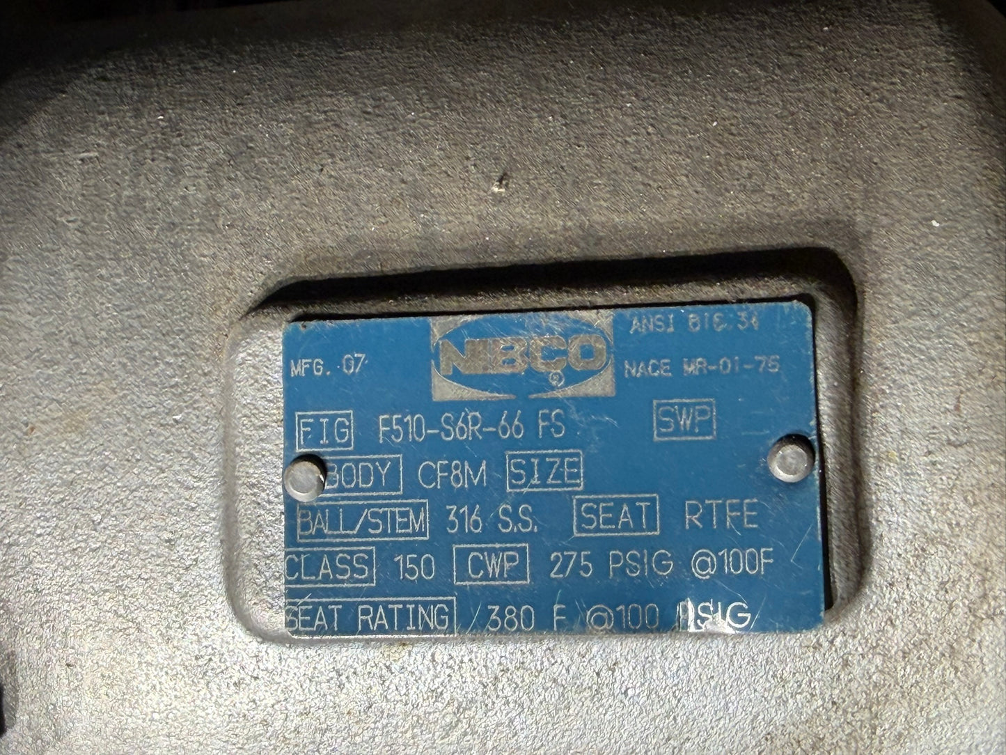 VL-32: NIBCO 4-inch stainless flanged ball valve. nameplate photograph 2.